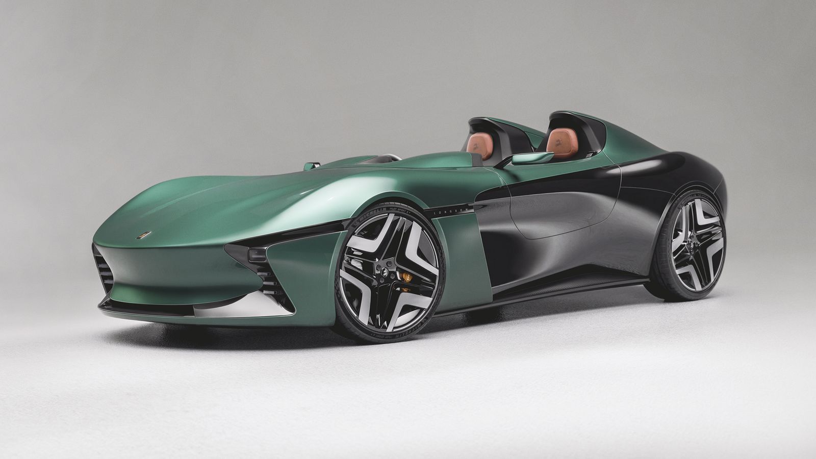 Side view of Longbow Featherweight Speedster a green car with subtle curves and seats exposed from the lack of a hard top.