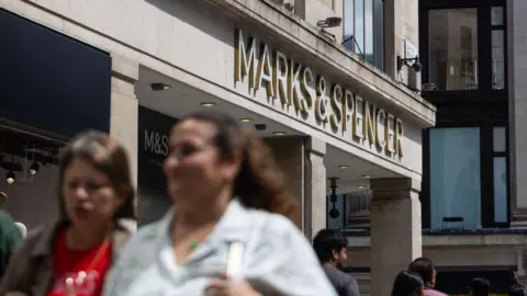 Getty Images A Marks & Spencer shop on a busy high street in summer