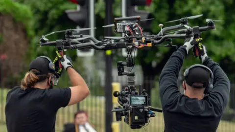 Netflix Camera operators guiding a drone during the filming of Adolescence