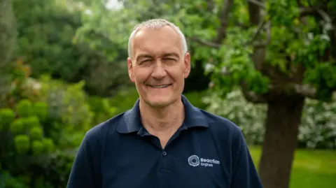 Richard Varvill Richard Varvill in a blue polo shirt
