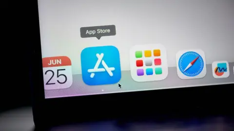 Getty Images The blue App Store icon is enlarged on a laptop screen as a user's cursor hovers over it. Displayed beside it are the icons of other Apple Mac apps such as Calendar and its Safari web browser.