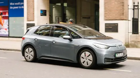 Getty Images A silver ID.3 Volkswagen vehicle is being driven along a road in London.