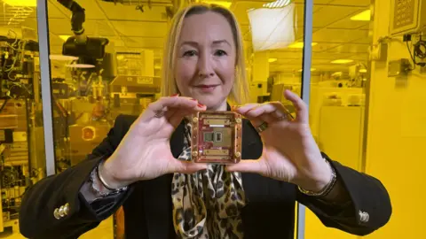 BBC Technology editor Zoe Kleinman holding Microsoft's Mmajorana quantum chip