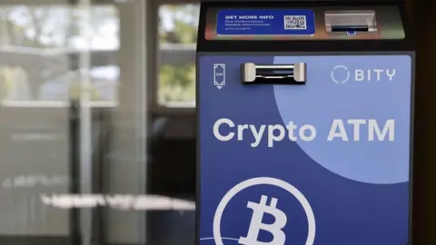 AFP via Getty Images A cryptocurrency ATM in Switzerland