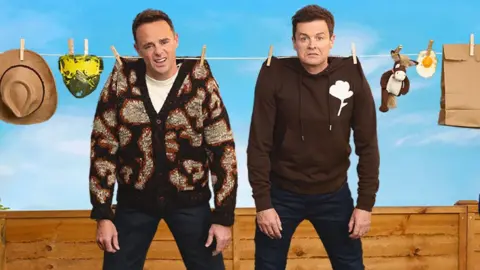 Simon Jones PR Ant and Dec pictured apparently hanging from a washing line in a promotional image for their new podcast Hanging Out